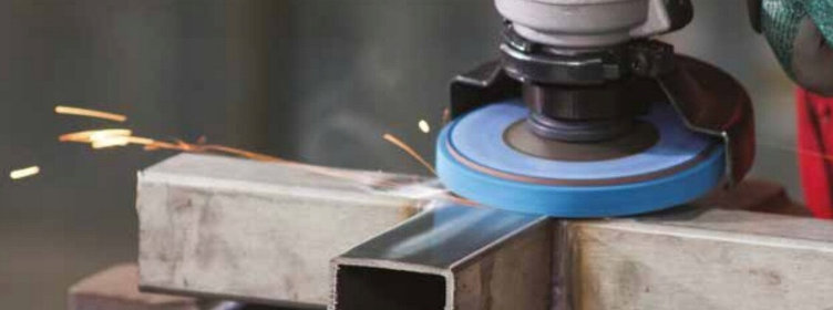Blending-disc-conditioning-surface-on-steel-box-section
