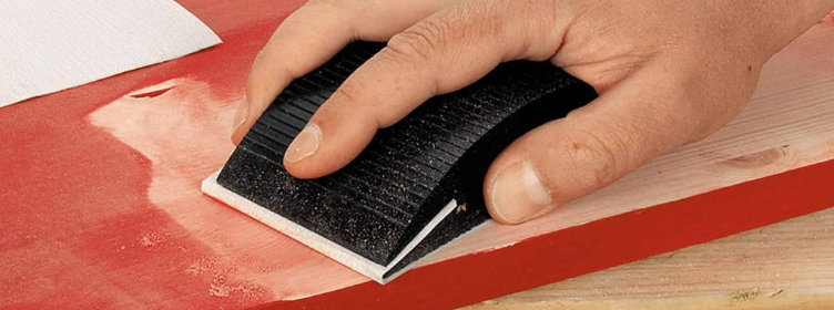 Hand-block-preparing-keying-surface-prior-to-painting