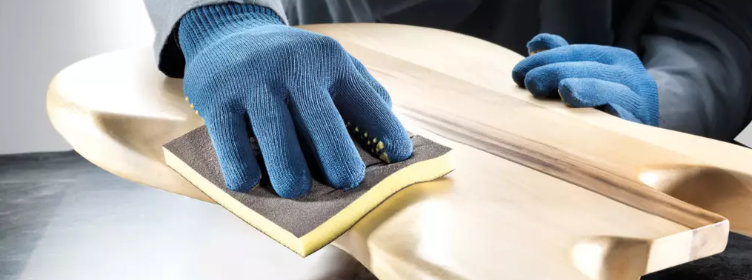 Hand-sanding-profiled-surface-with-sanding-sponge