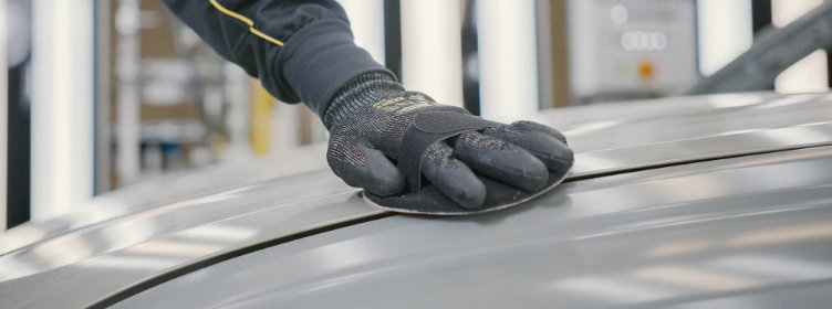 Primer-sanding-on-car-bonnet-with-round-hand-pad-holder